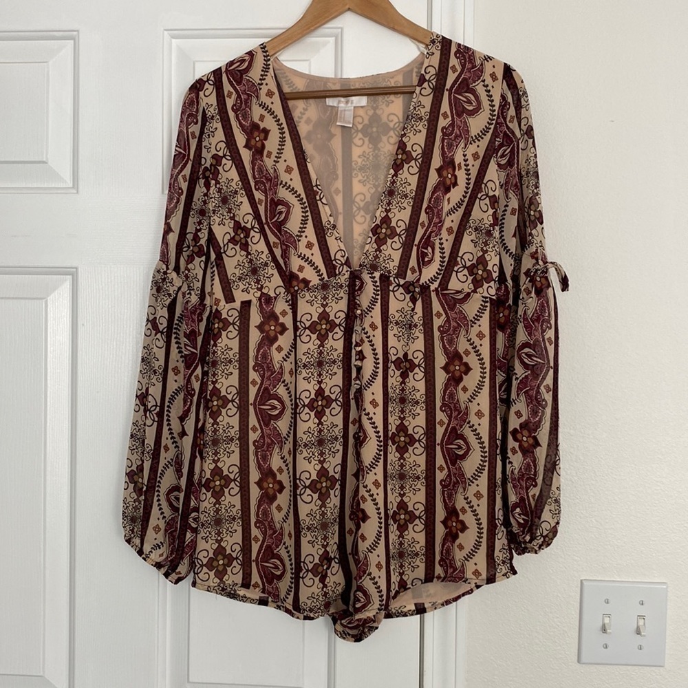 Forever 21 long sleeve boho jumpsuit with plunging neck line.